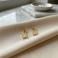 Boucles d'oreilles acier inoxydable trefles . dorées