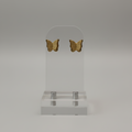 Boucles d'oreilles acier inoxydable motif papillon brillants.