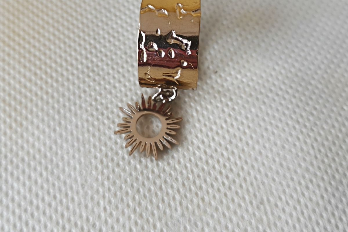 Bague acier inoxydable avec breloque soleil ajustable