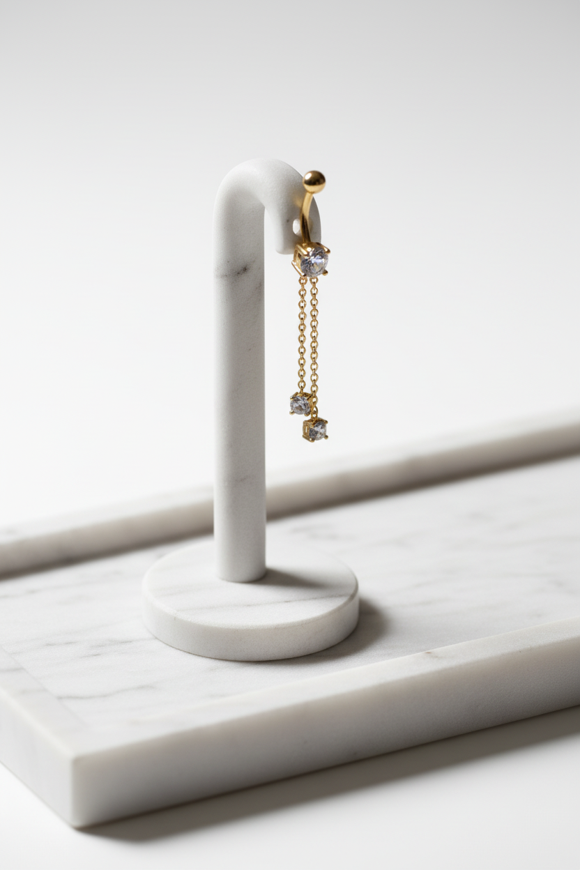 Piercing nombril acier inoxydable doré 2fils pendants. avec oxydes de zirconium Blancs
